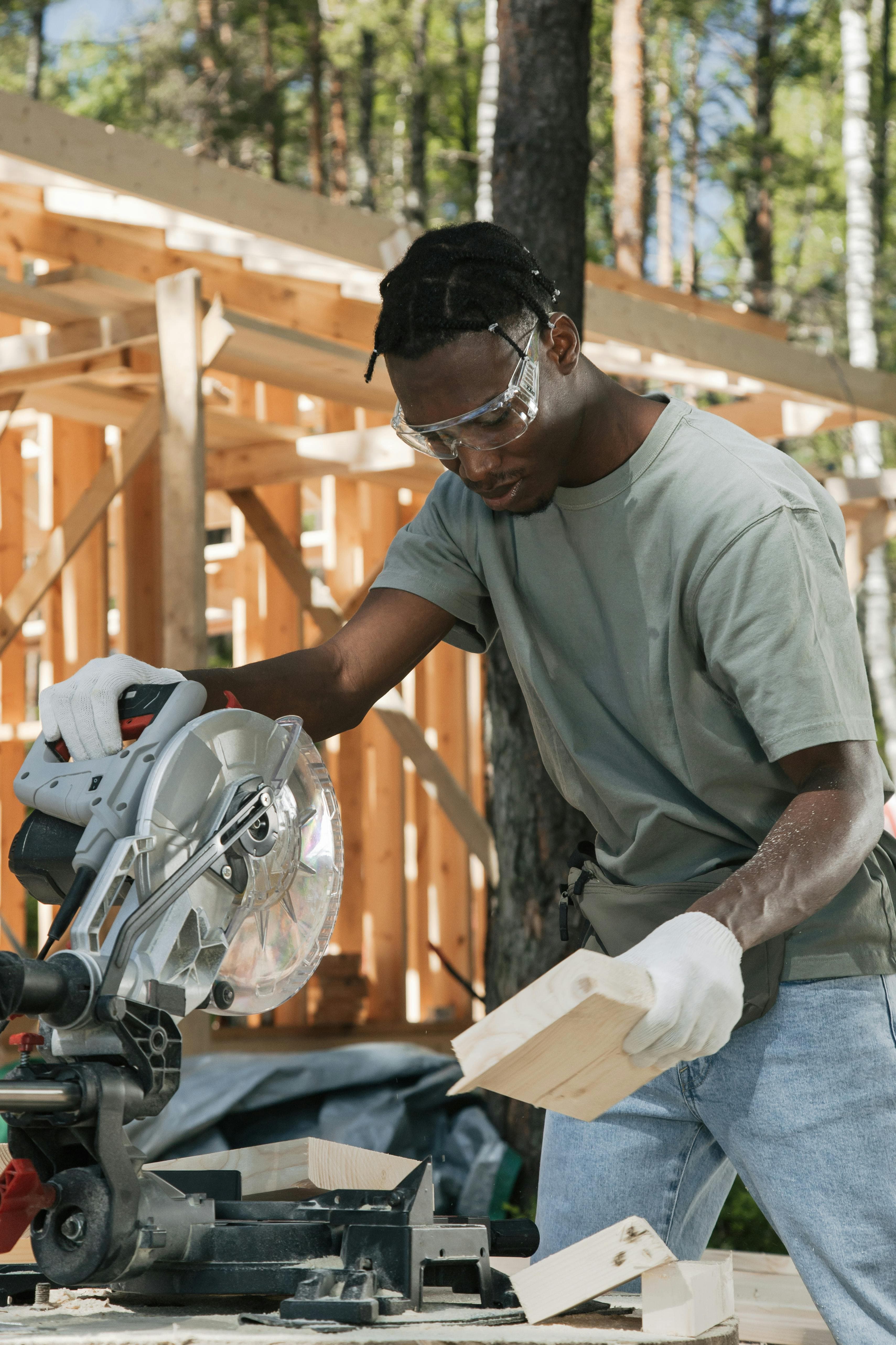 Skilled worker cutting wood during a construction project